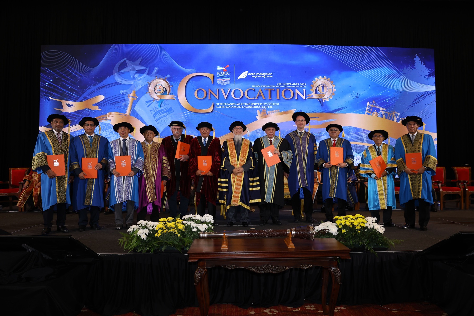 NMUC academic leaders and graduates on stage at the convocation ceremony